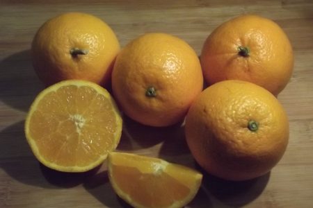 Oranges On A Chopping Board