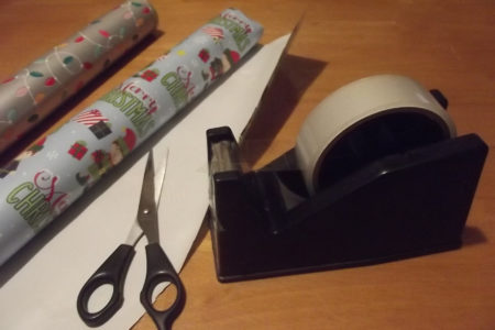 Wrapping Presents With sellotape,Scissors And Wrapping Paper