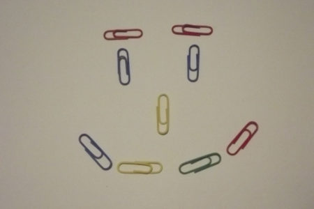 Coloured PaperClips On A Whie Background